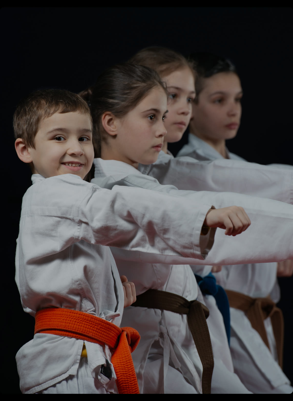 Children practicing karate together — everyday activities funded by the Just Like You Scholarship.